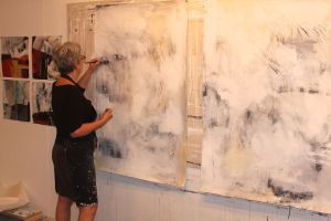 Brucie Holler, Artist, works in her studio.